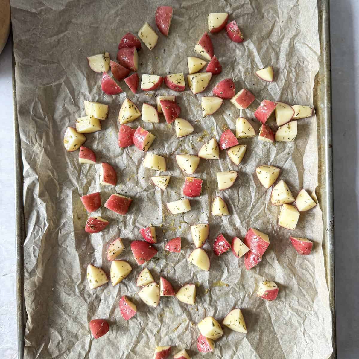 diced potatoes on a baking sheet.
