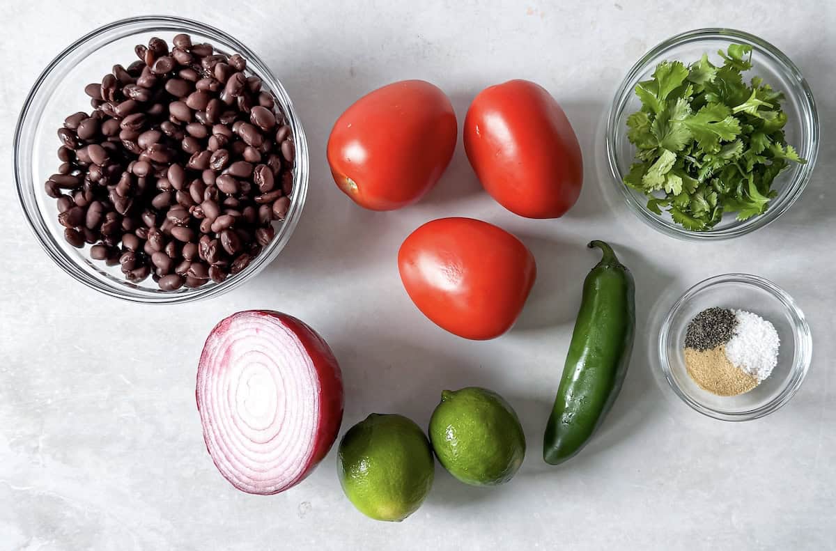 ingredients for black bean salsa no corn on a table.