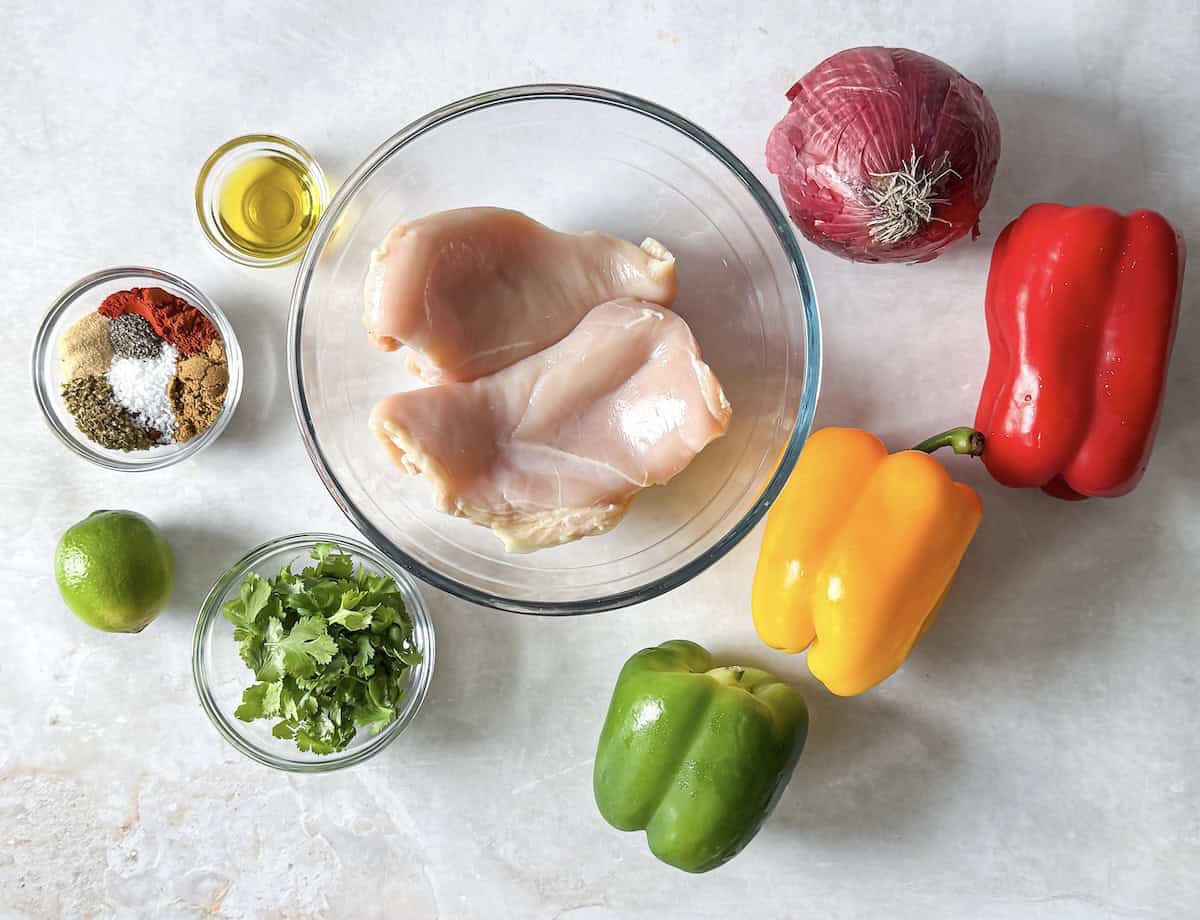 ingredients for chicken fajita shset pan meal on a table.