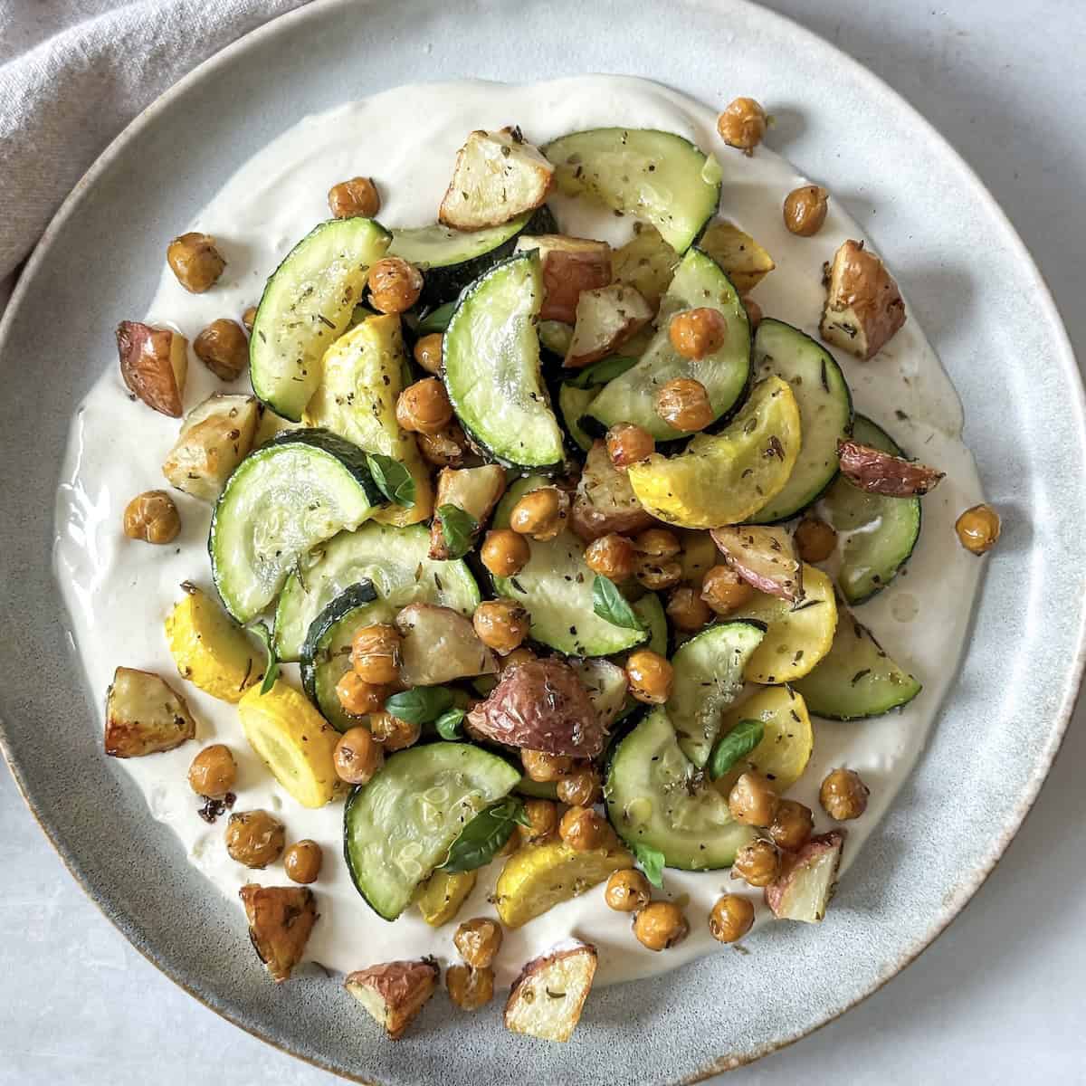 overhead view of roasted zucchini salad on a plate close up 2.