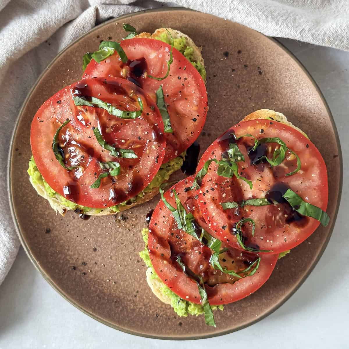 close up overhead view of avocado tomato toast.