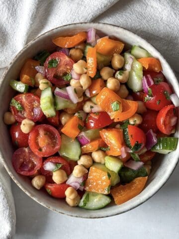 overhead view of chickpea salad with cilantro in a bowl.