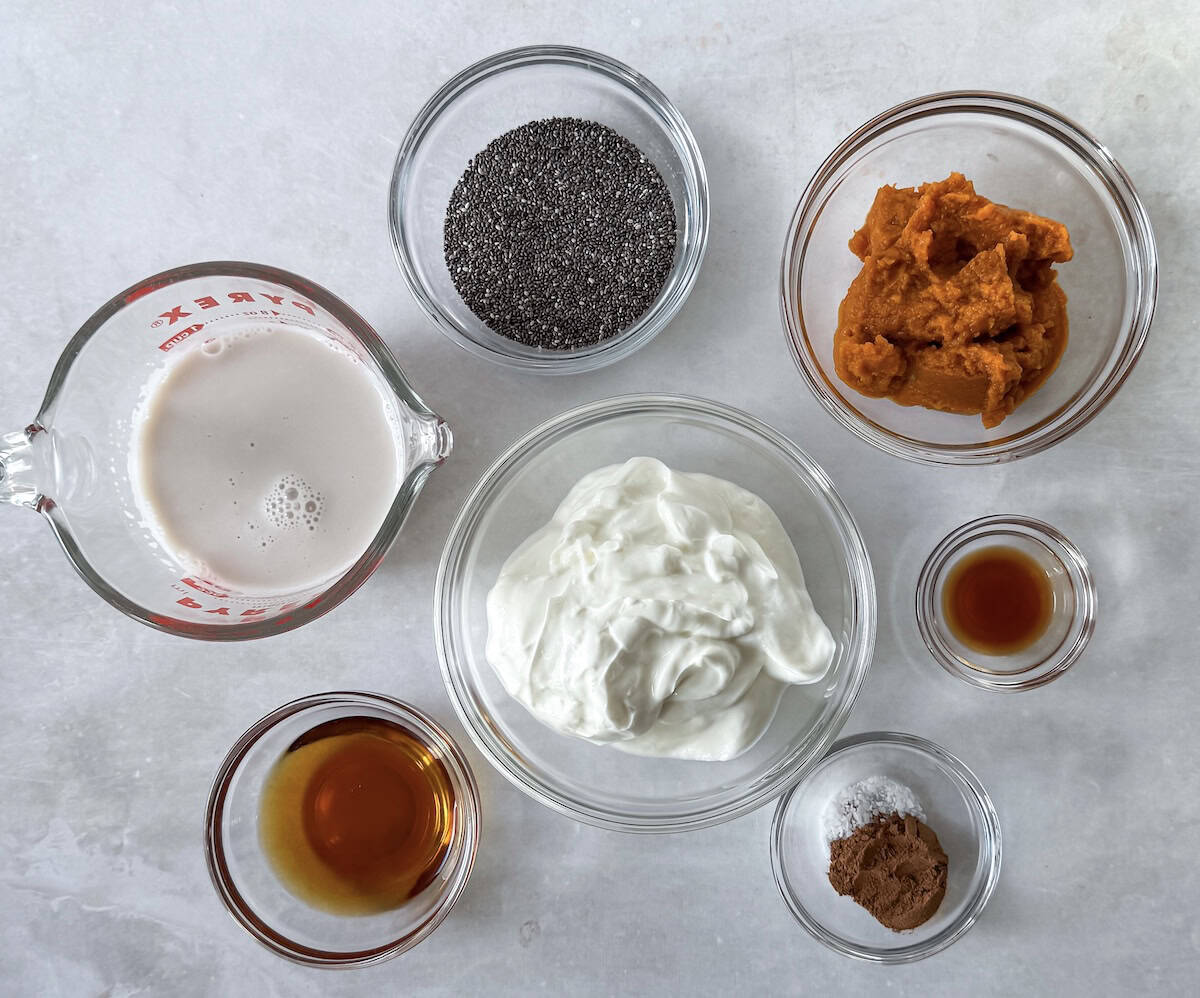 ingredients for pumpkin chia pudding on a table.
