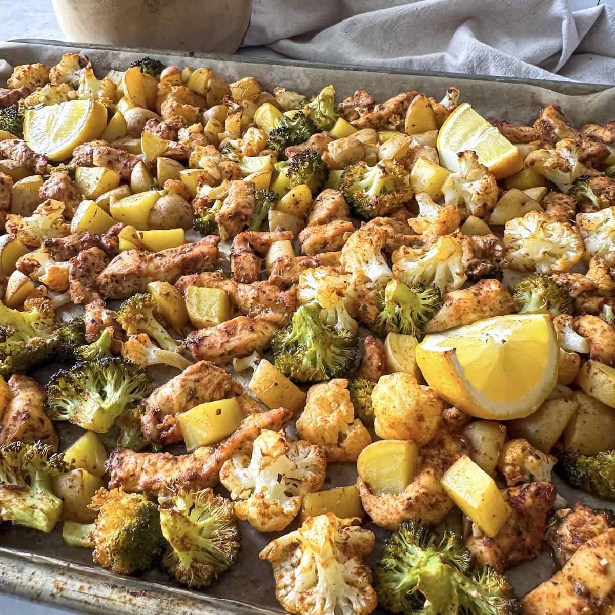 sheet pan chicken broccoli and potatoes side view