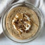 protein pancake bowl with greek yogurt, granola, and nut butter on top.