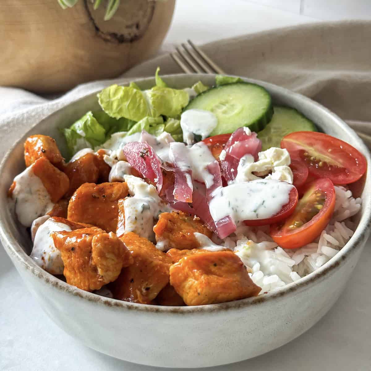 close up side view of buffalo chicken bowl.