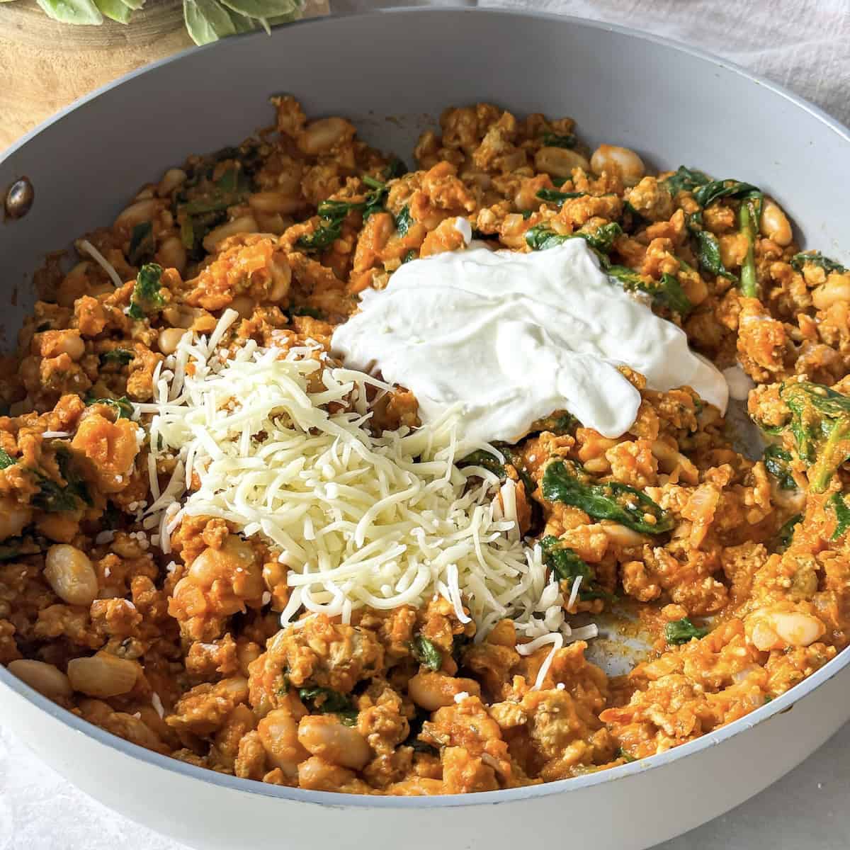 greek yogurt and mozzarella cheese on a pumpkin turkey skillet.