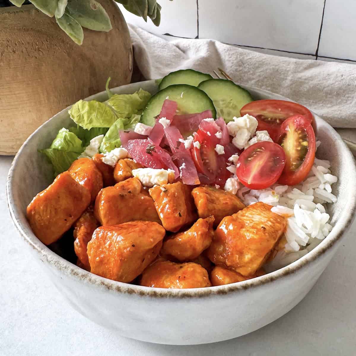 side view of buffalo chicken bowl without ranch.