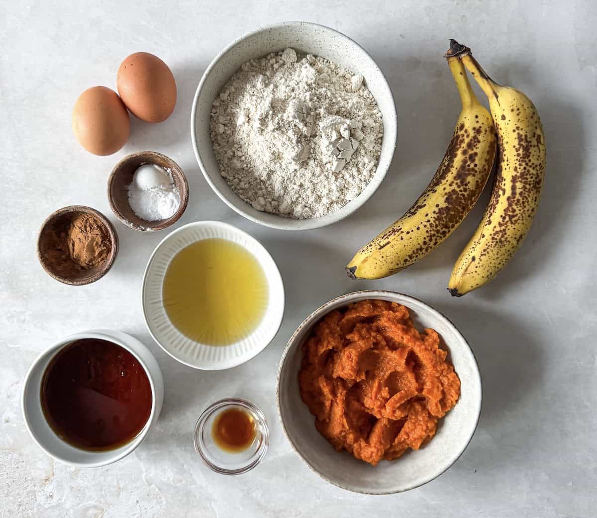 ingredients for healthy pumpkin banana bread on a table.