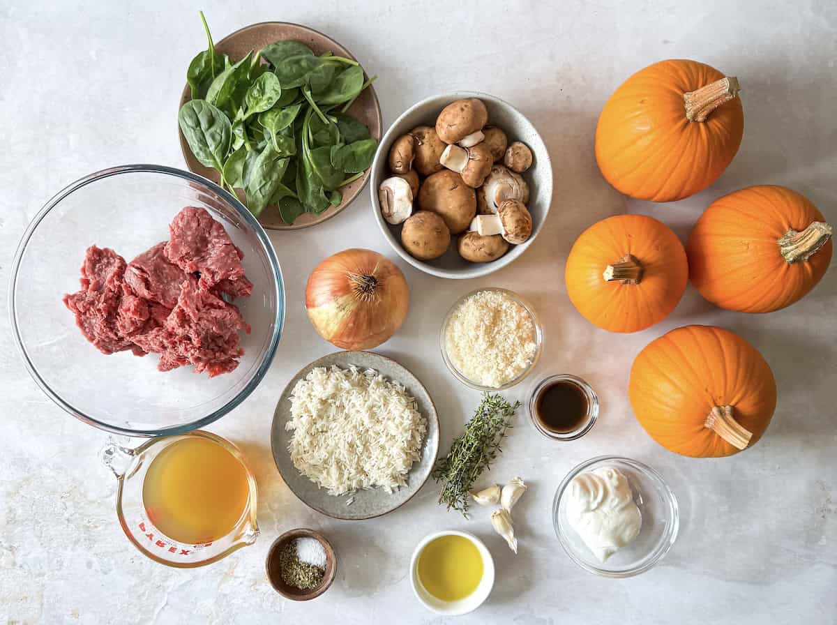 ingredients for stuffed pumpkins on a table.