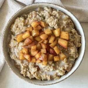 overhead view of apple cinnamon oatmeal in a bowl.