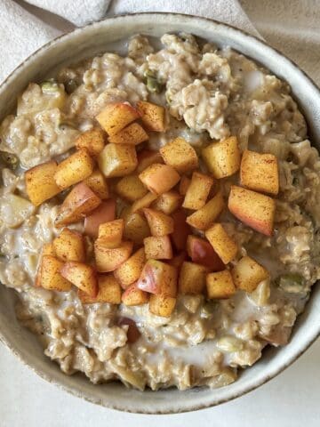 overhead view of apple cinnamon oatmeal in a bowl.