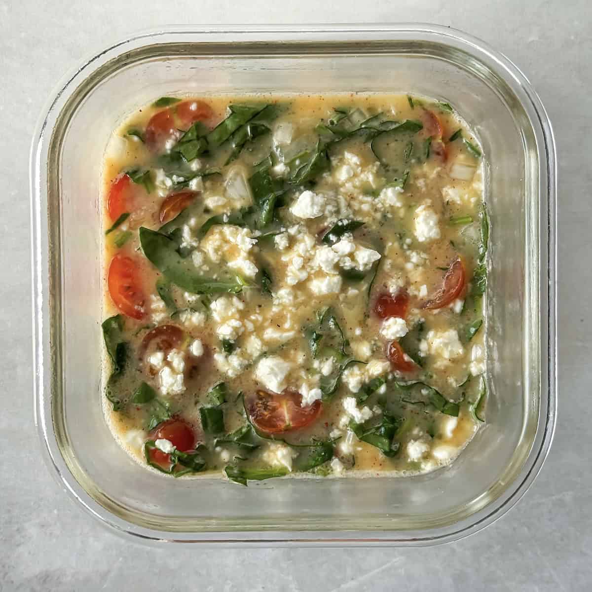overhead view of high protein egg bake with feta added to the top.