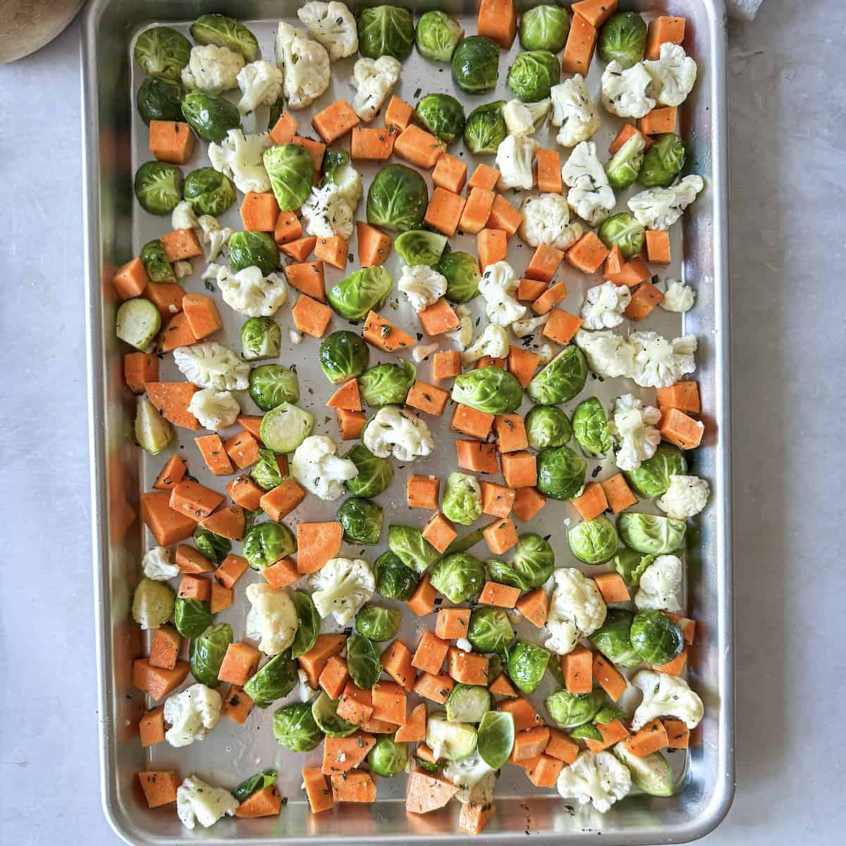 overhead view of vegetables on a sheet pan.