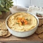 side view of butternut squash hummus with seed crackers.