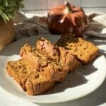 sliced healthy banana pumpkin bread on a plate.