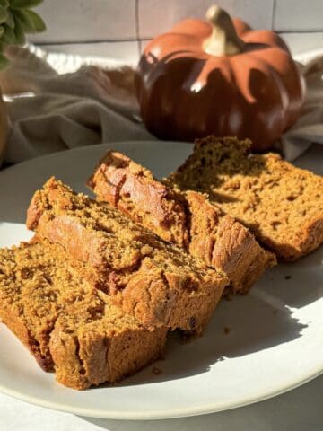 sliced healthy banana pumpkin bread on a plate.