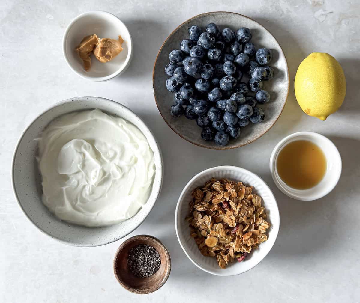 overhead view of greek yogurt bowl ingredients.