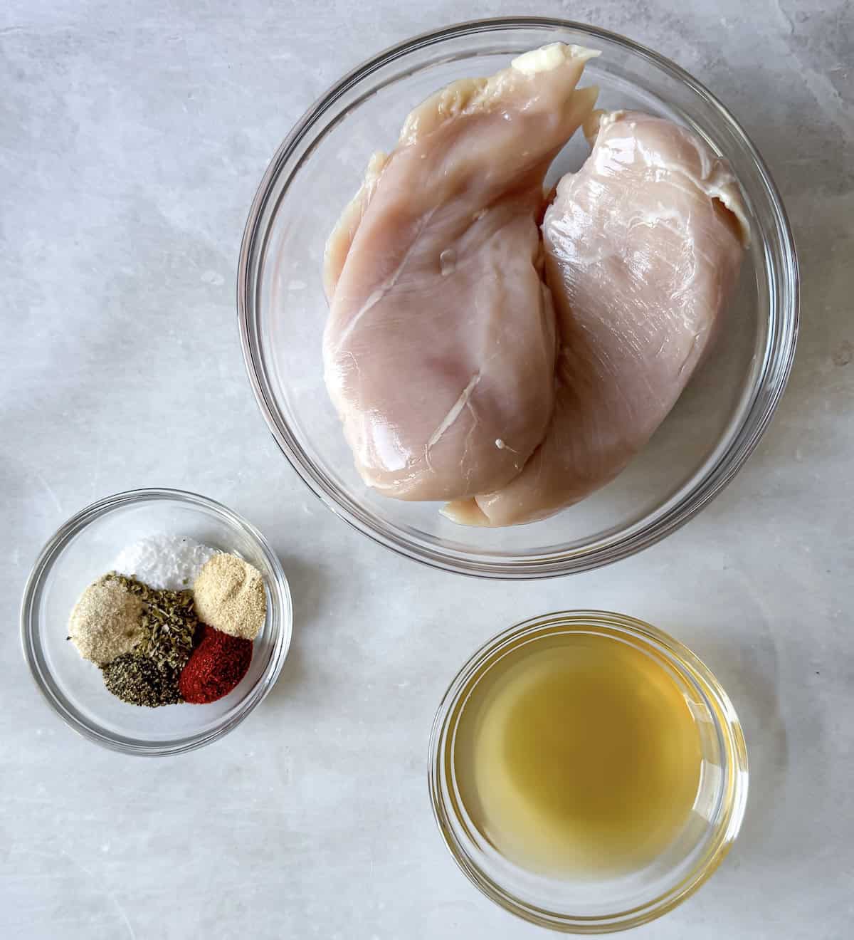 overhead view of slow cooker shredded chicken breast ingredients.