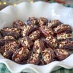 portrait goat cheese stuffed dates in a pie pan.
