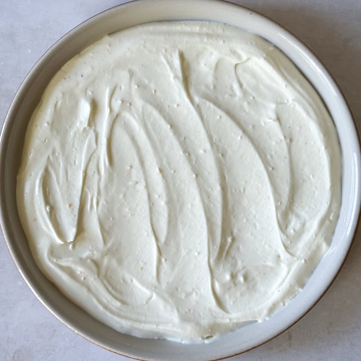 whipped goat cheese and cottage cheese spread on a plate.