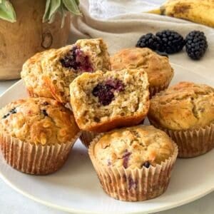 blackberry banana oatmeal muffins on a plate.
