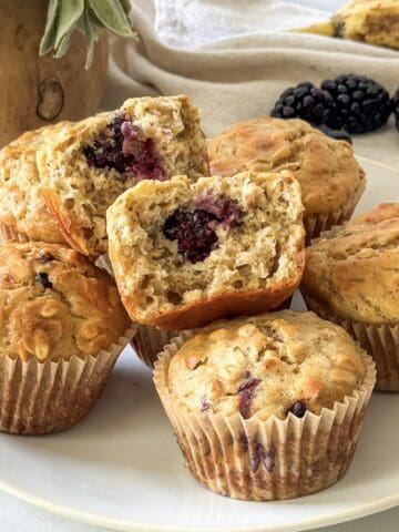 blackberry banana oatmeal muffins on a plate.