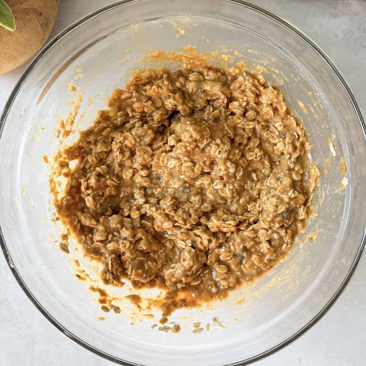 dry and wet ingredients for breakfast cookies in a glass bowl.