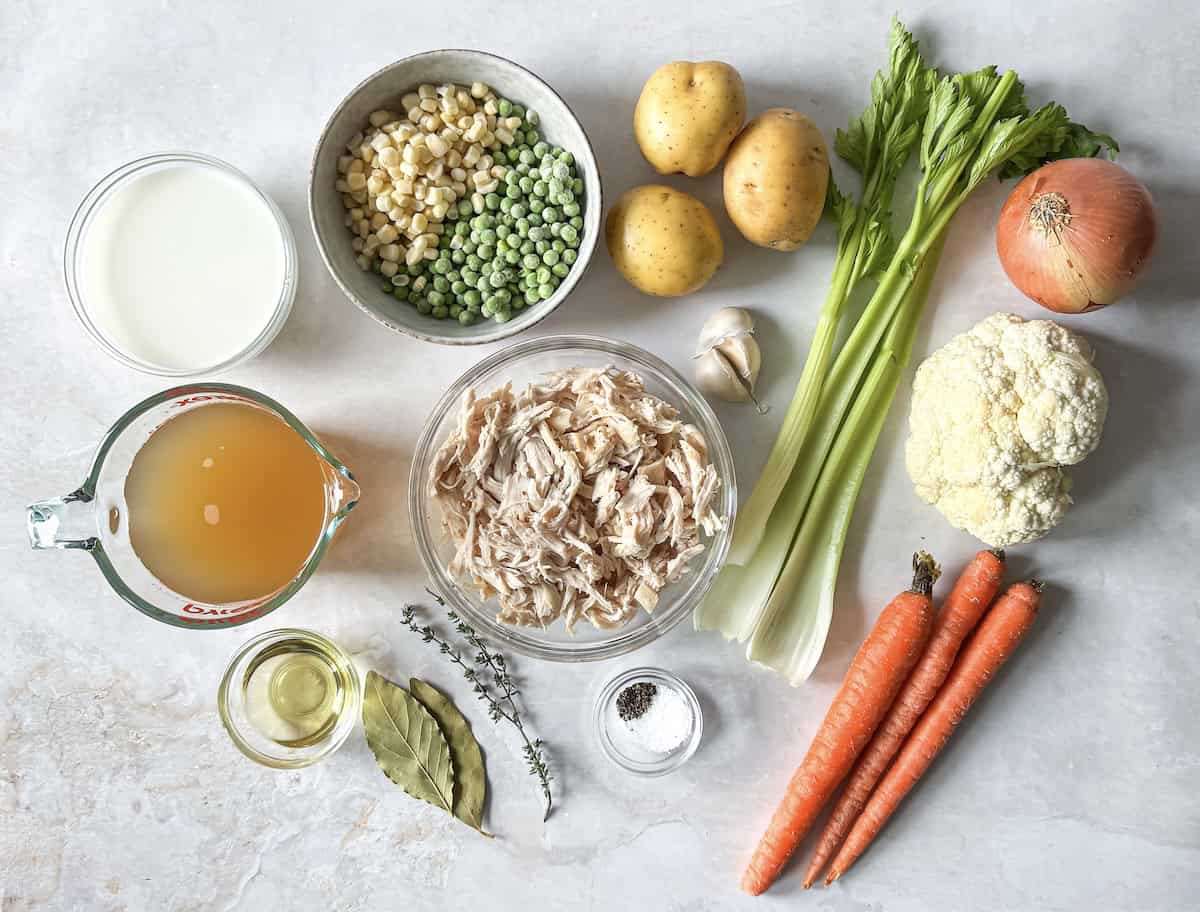ingredients for chicken pot pie soup on a table.