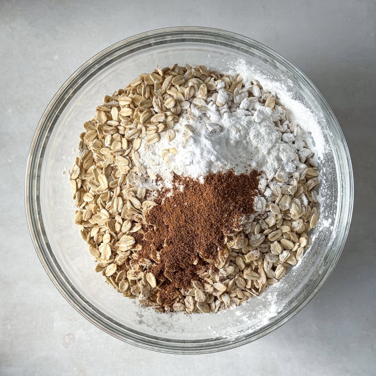 overhead view of dry ingredients for blackberry banan aotmeal muffins.