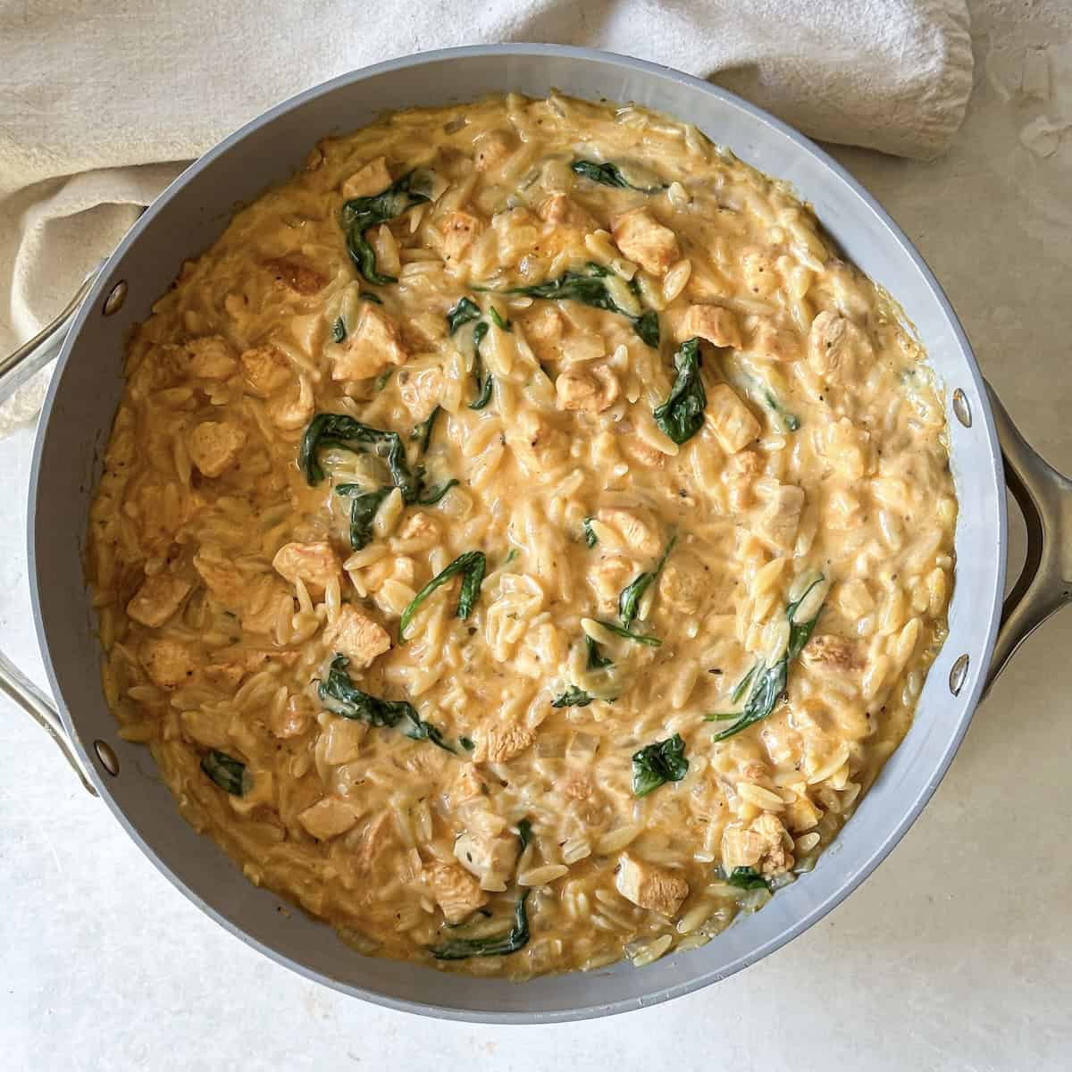 overhead view of lemon chicken orzo skillet.