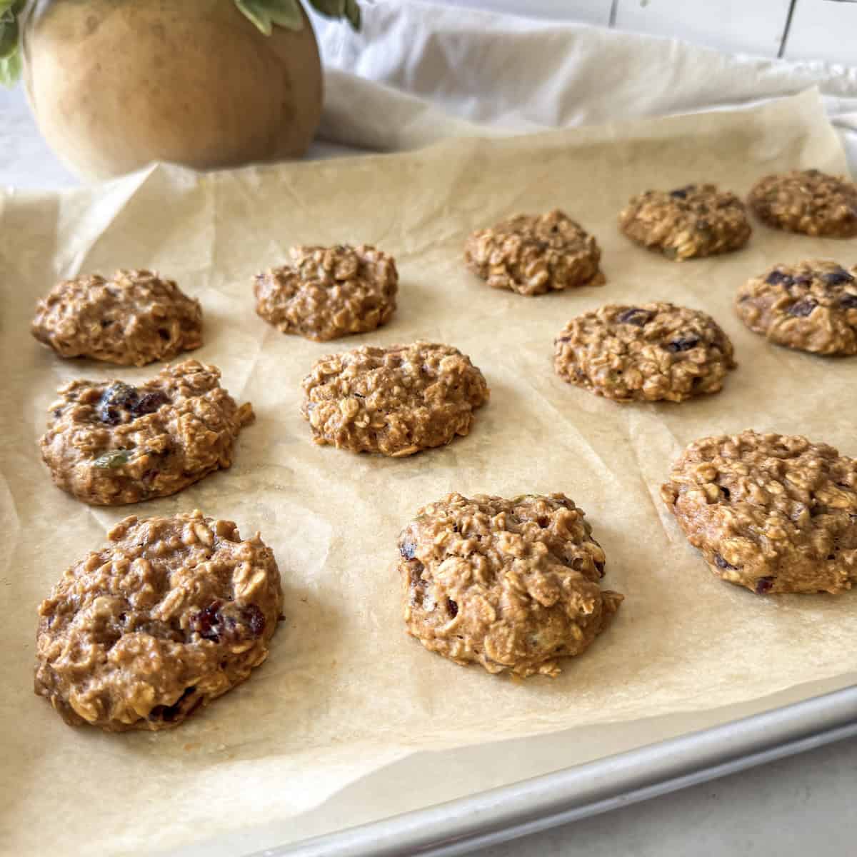 side view of breakfast cookies on a baking sheet.
