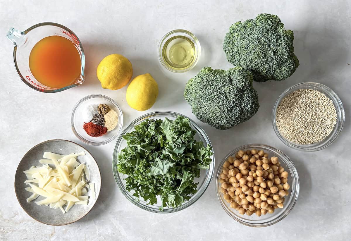 base ingredients for kale chickpea quinoa salad on a table.
