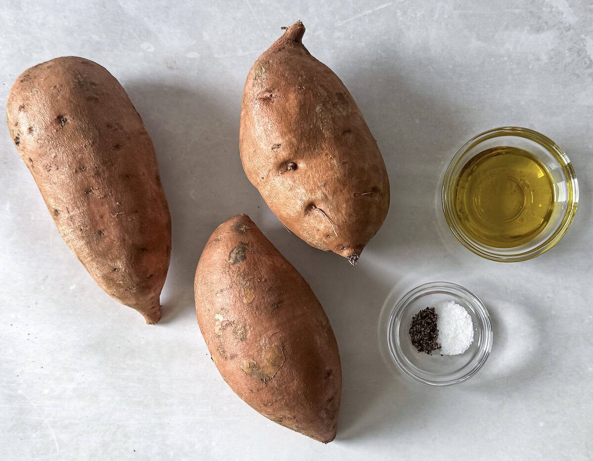 ingredients for roasted sweet potato halves on a table.