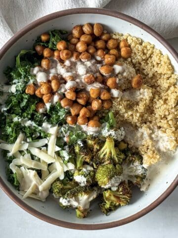 kale chickpea quinoa salad with broccoli in a bowl.