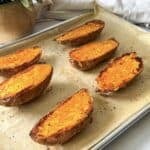 roasted sweet potato halves on a baking sheet.