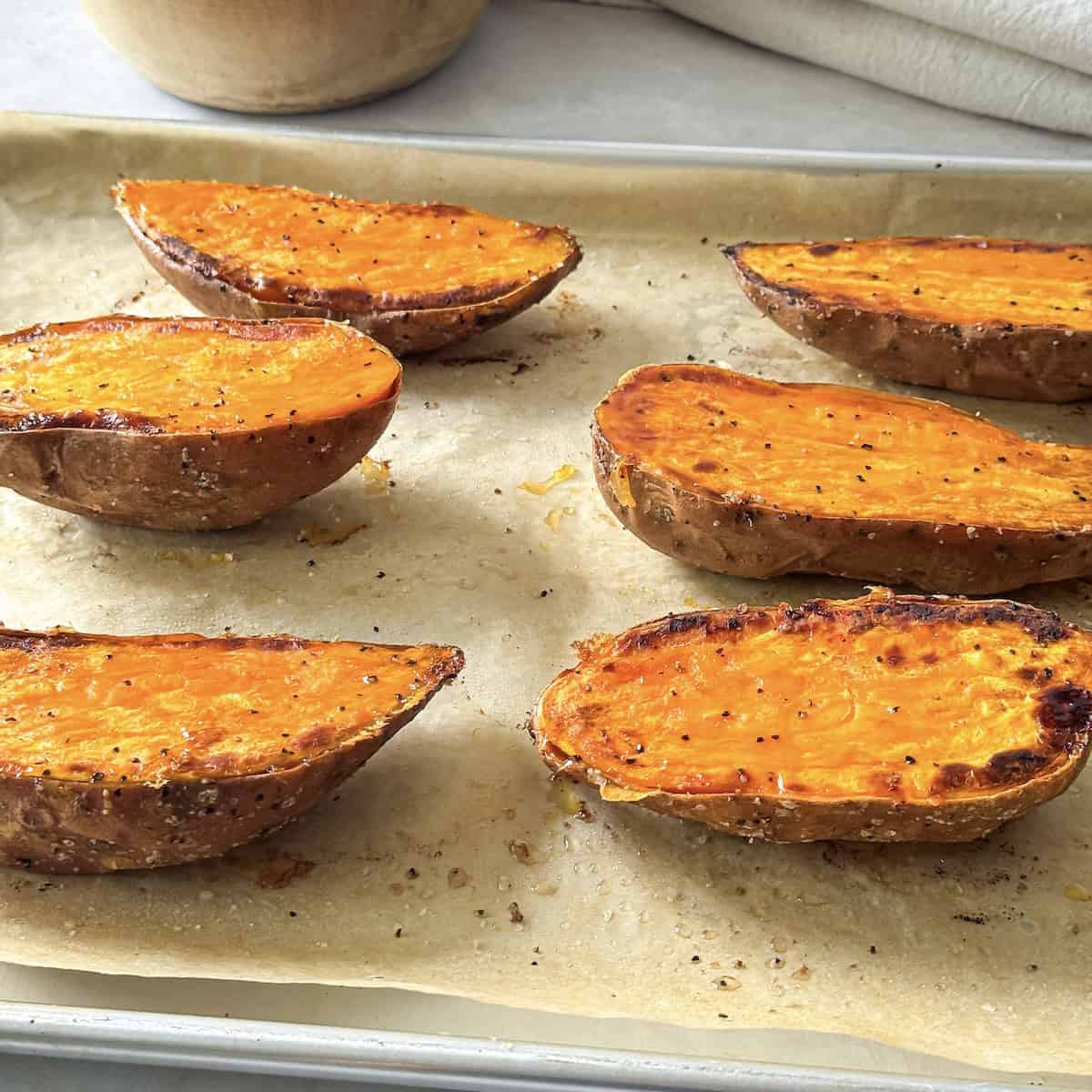 roasted sweet potato halves on a baking sheet. 5