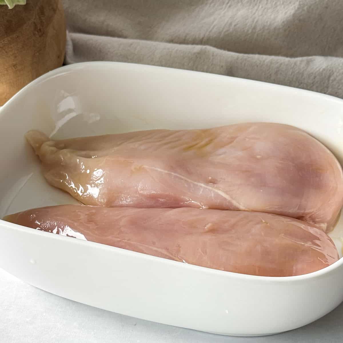 chicken breast coated in olive oil.