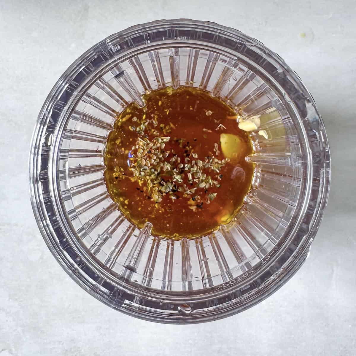 overhead view of red wine vinaigrette ingredients in a blender.