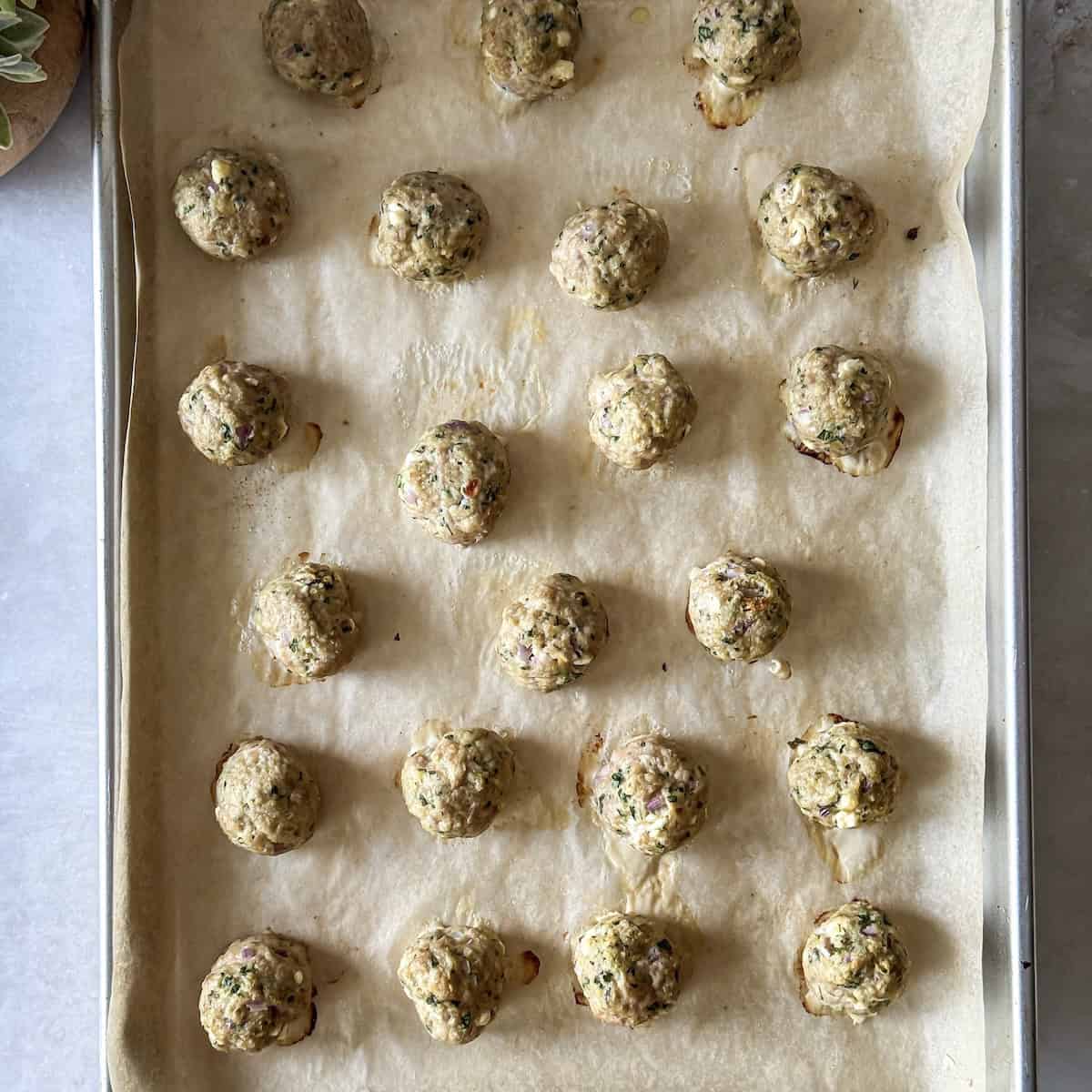turkey feta meatballs on a sheetpan. overhead view.