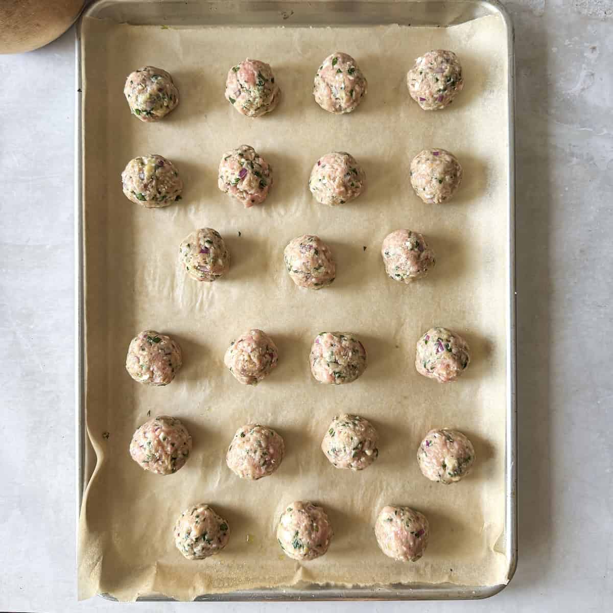 turkey feta meatballs on a sheetpan. raw