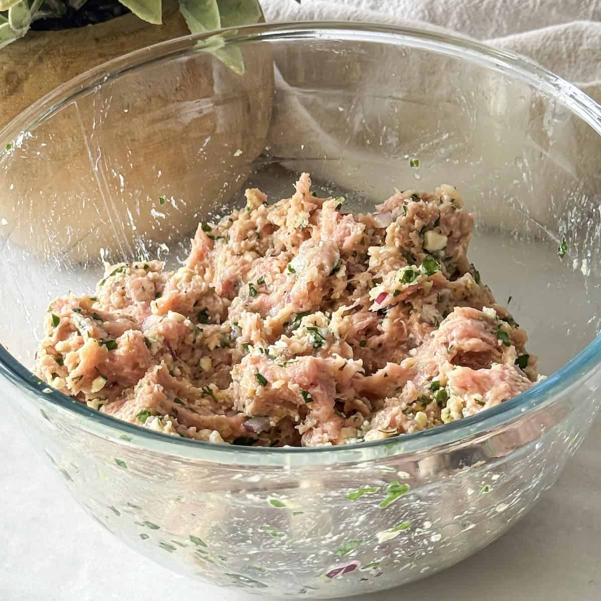 turkey meatball mixture in a glass bowl.