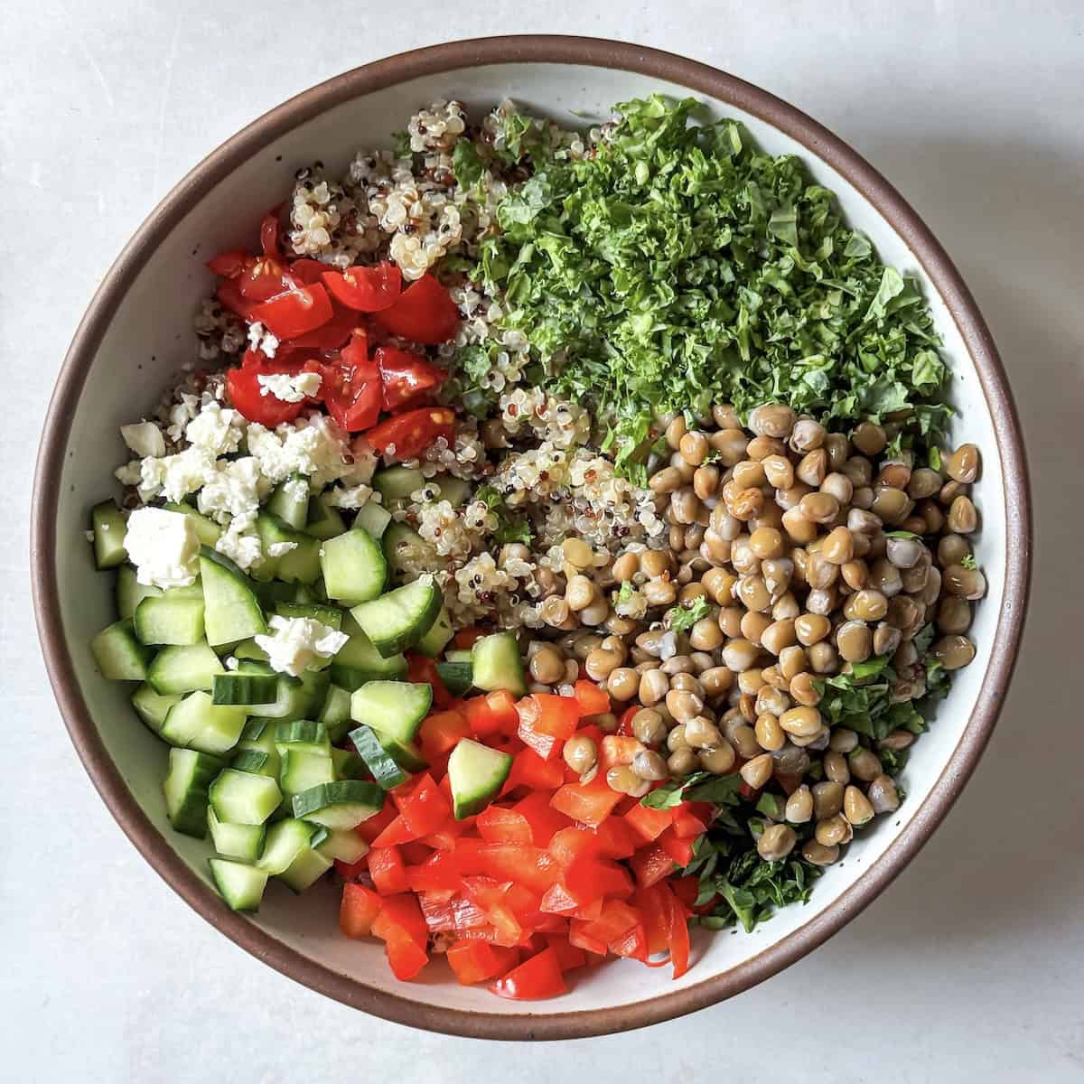 overhead view of copycat quinoa salad ingredients in a bowl.