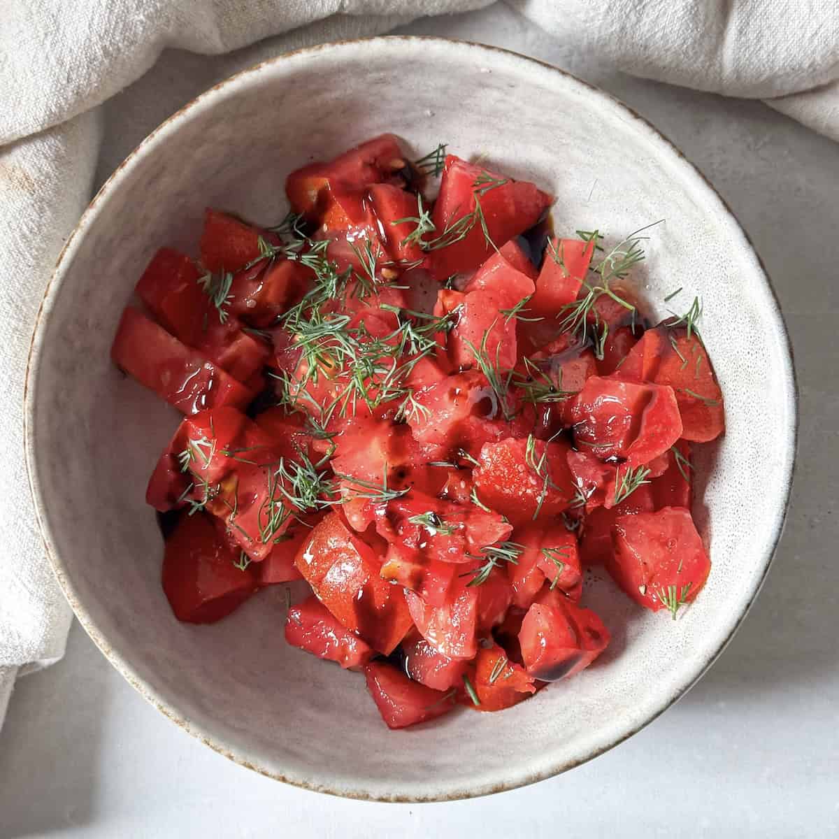 overhead view of tomato dill salad.