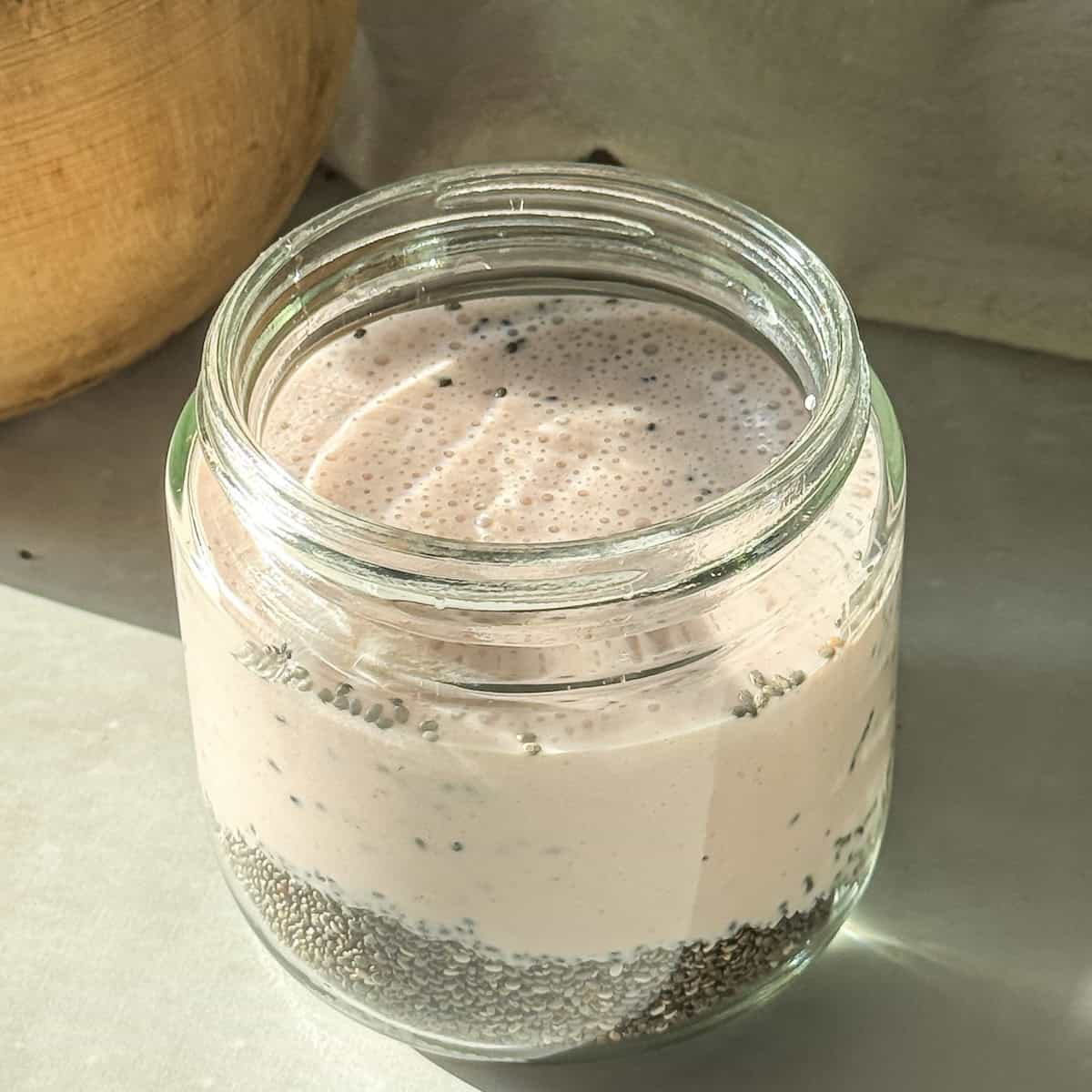 strawberry milk poured over chia seeds.