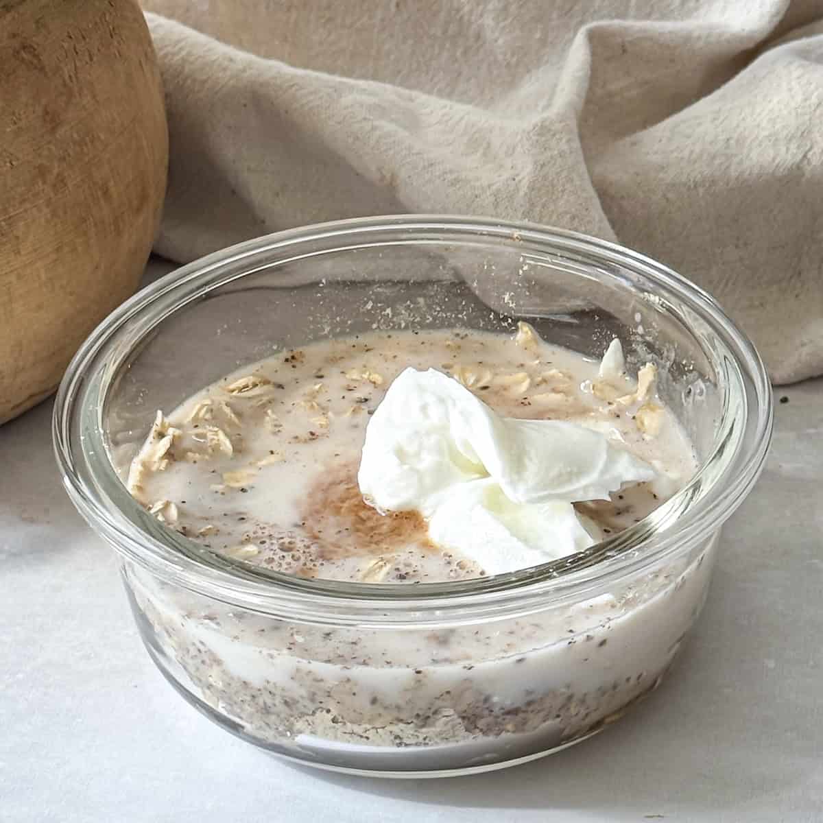 wet ingredients for high protein overnight oats stirred in with the dry ingredients.