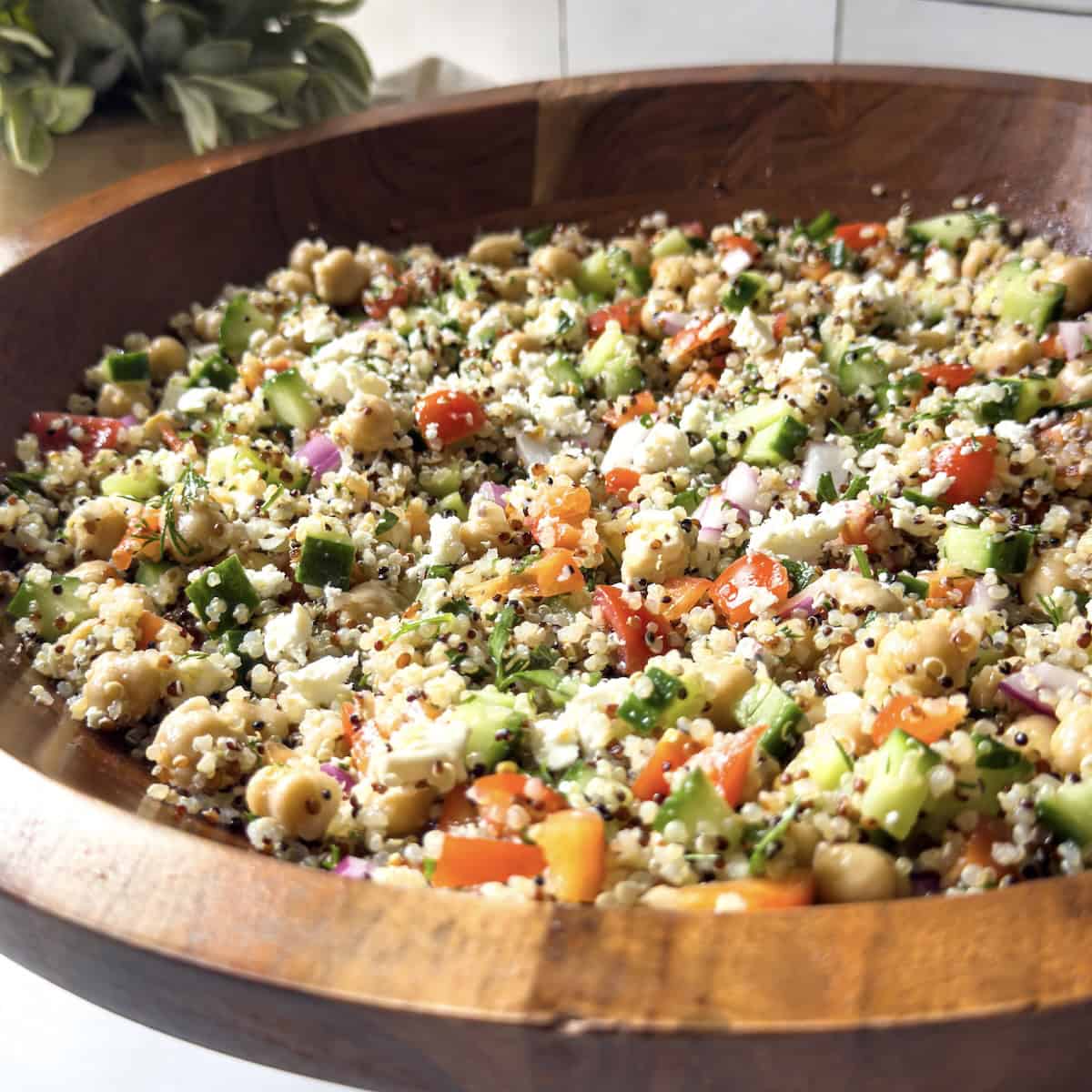 chickpea quinoa salad in a wooden bowl.