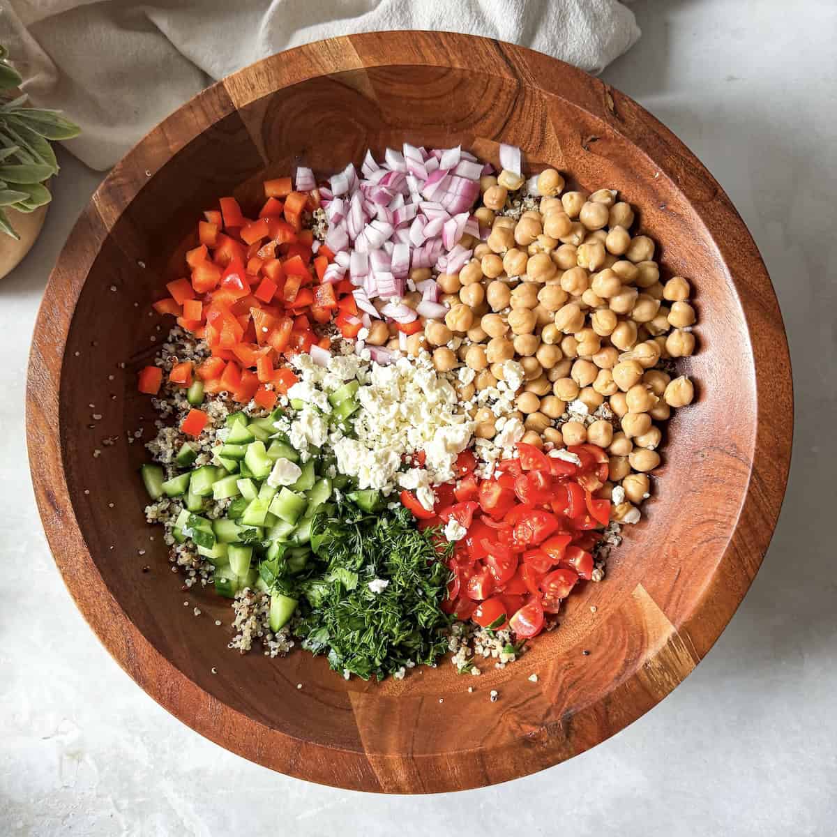 chickpea quinoa salad ingredients in a bowl.