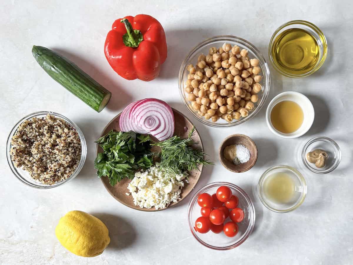 ingredients for quinoa chickpea salad on a table.