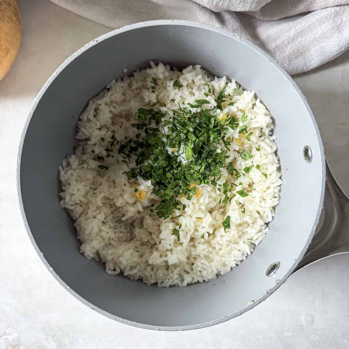 parsley, lemon zest, rice in a saucepan.
